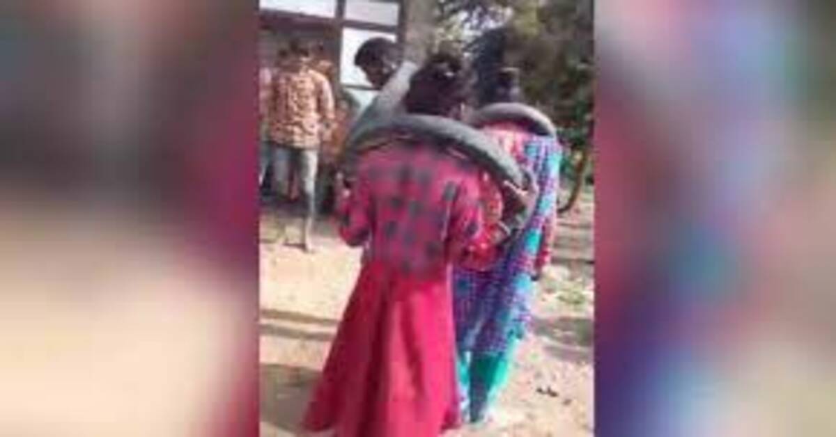 ప్రేమికుల మెడలో టైర్లు, అందరి ముందు బలవంతంగా డ్యాన్స్-వీడియో వైరల్