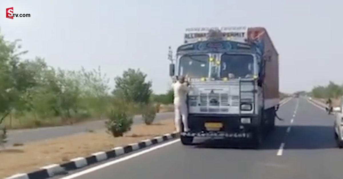 టోల్‌గేట్‌ సిబ్బందికి ముచ్చెమటలు పట్టించిన లారీ డ్రైవర్‌