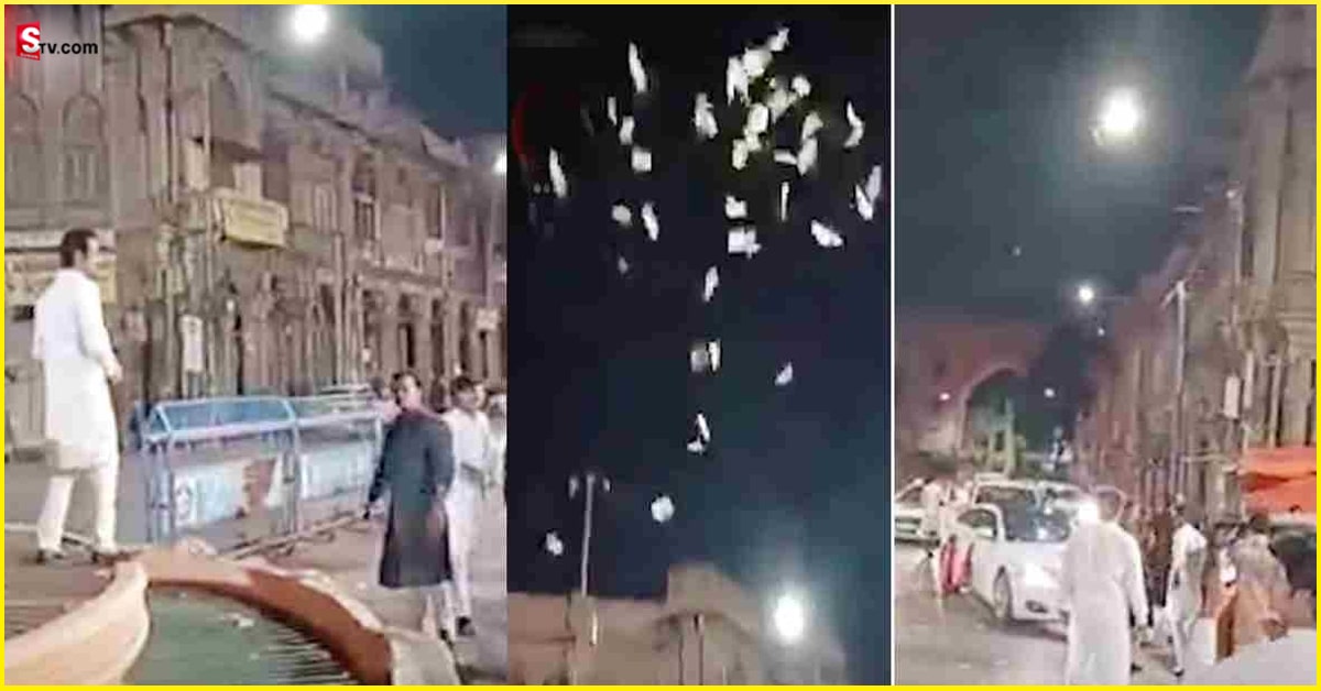 కరెన్సీ నోట్లు గాల్లోకి విసిరిన యువకులు.. వీడియో వైరల్