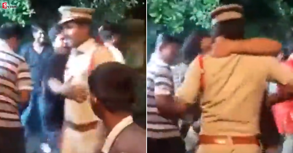 నడి రోడ్డుపై పోలీస్ ఆఫీసర్ కు ముద్దు పెట్టిన యువకుడు.. వీడియో వైరల్!