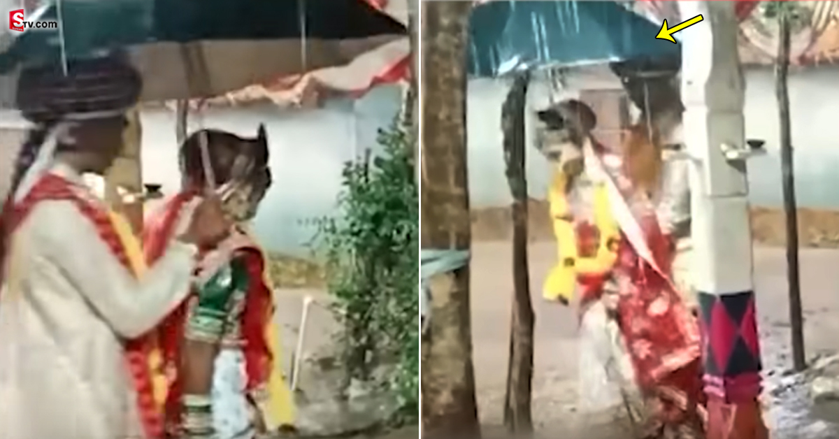 వీడియో: జోరువానలో పెళ్లి.. గొడుగు వేసుకుని ‘ఏడడుగులు’