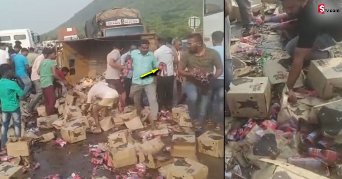 నడి రోడ్డుపై బీరు బాటిల్స్ కోసం ఎగబడ్డ జనం..